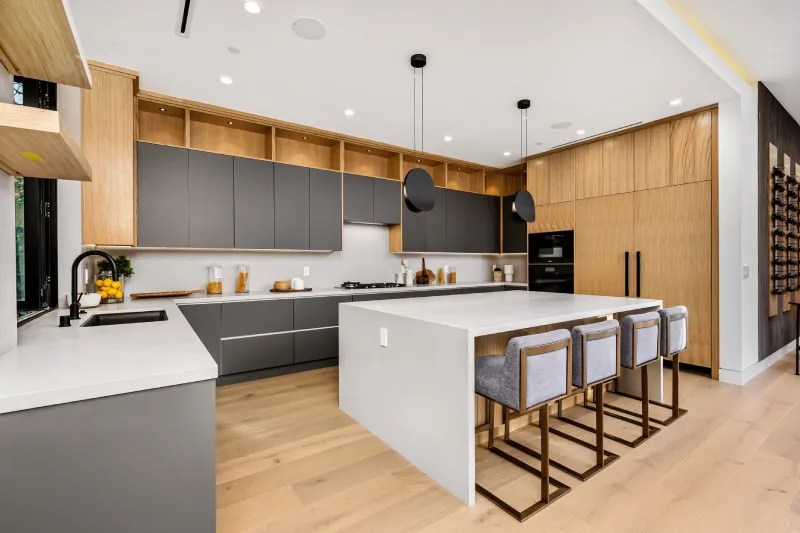 Modern kitchen interior with a large island and sleek cabinetry